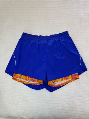 Fabletics Royal Blue Athletic Shorts with Orange-Pink Liner